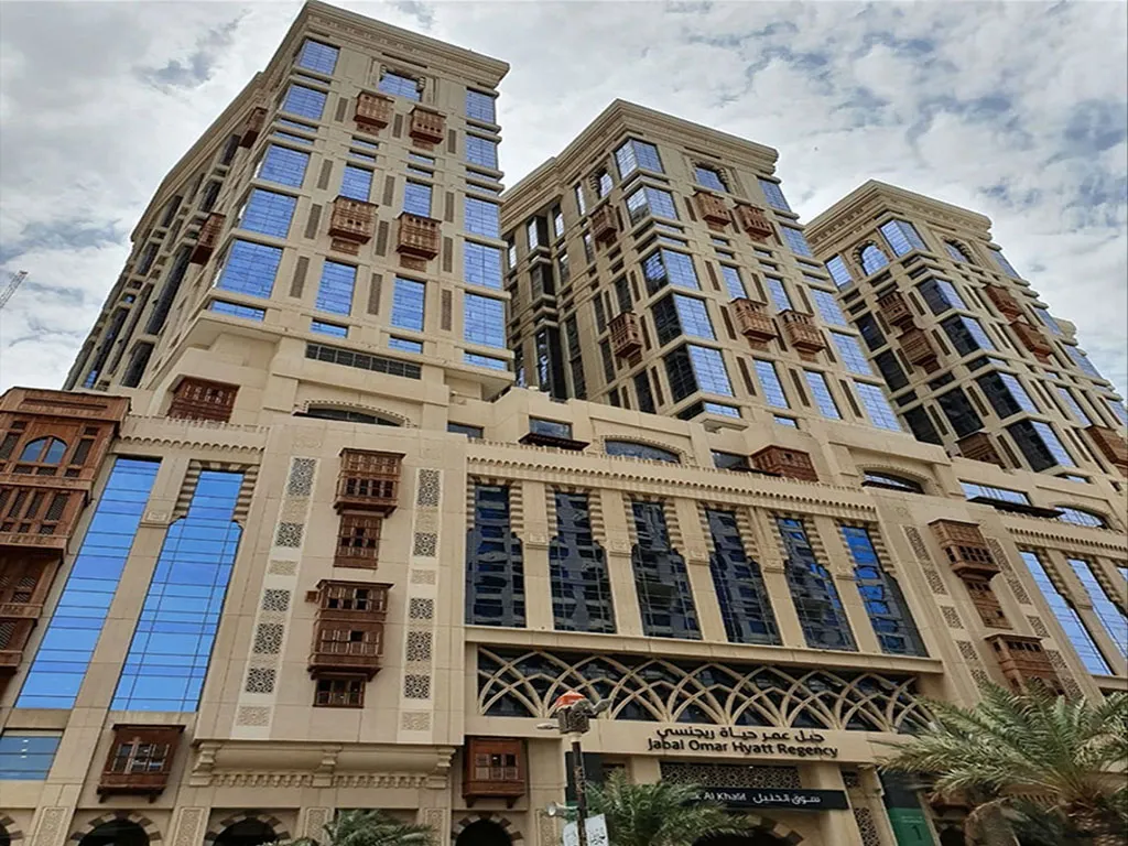 Architectural exterior view of the Jabal Omar Hyatt Regency hotel in Makkah with traditional design elements.