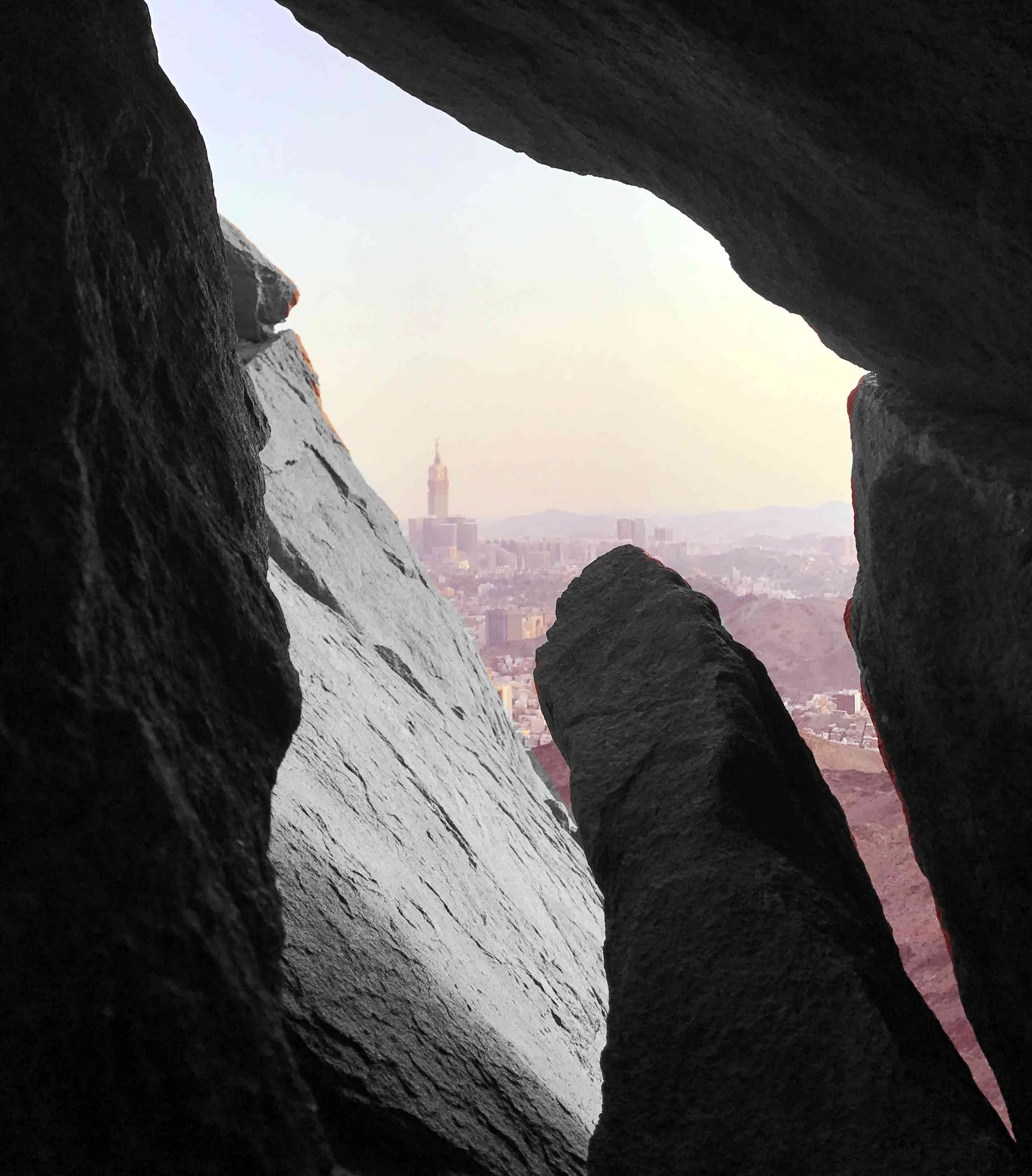 The entrance area of the historic Cave of Hira, showing the surrounding rocky landscape