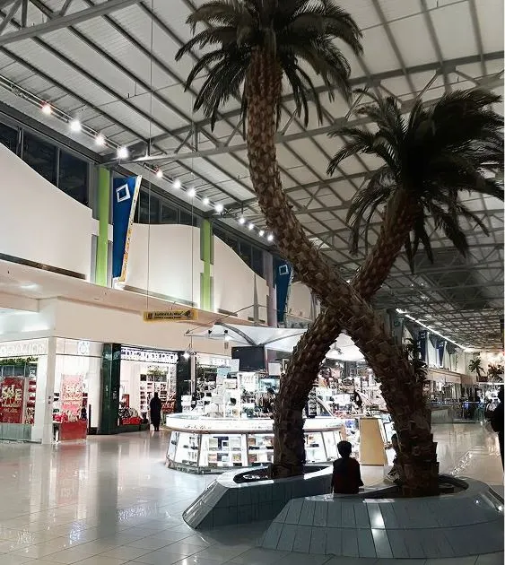 Interior view of Al Diyafat Mall decorated with Ramadan ornaments and a large festive inflatable figure.