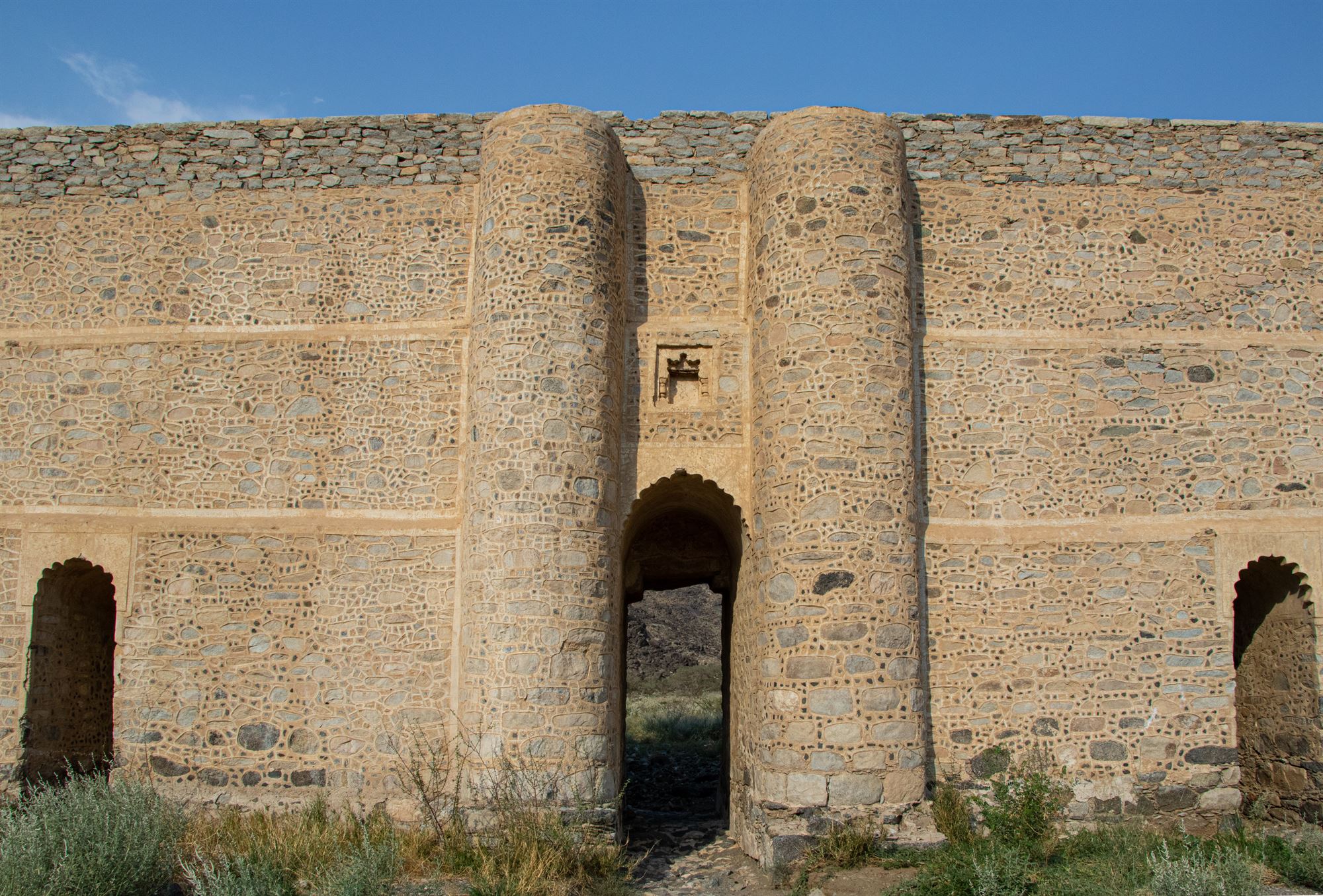 A clear view of the main stone structure and arches of Ain Zubaidah, a testament to ancient engineering in Makkah.