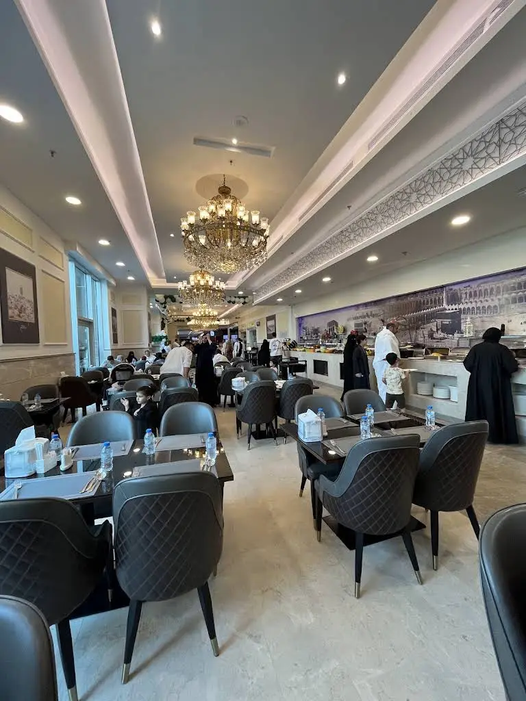 The welcoming interior dining area of Alshurfa Restaurant, showcasing the buffet layout and guest seating.